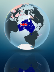 Obraz premium Australia on globe with flags