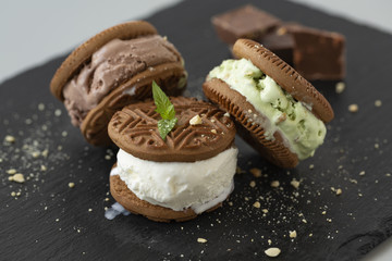 Homemade sandwiches with vanilla, pistachio and chocolate ice cream.