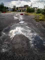 Clouds reflected in a puddle 2