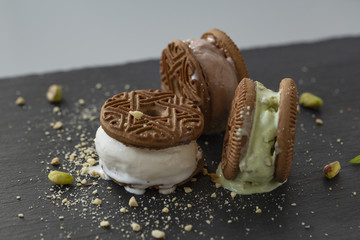 Homemade sandwiches with vanilla, pistachio and chocolate ice cream.