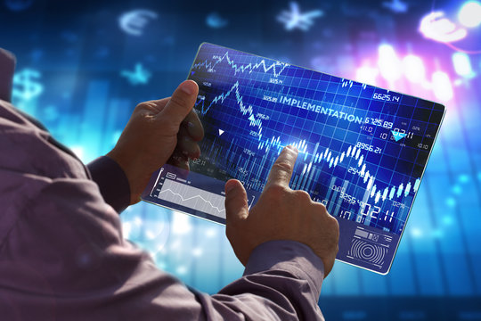 The concept of business, technology, the Internet and the network. A young entrepreneur working on a virtual screen of the future and sees the inscription: Implementation