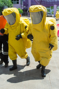 Fireman wear hazmat (hazardous material) suits