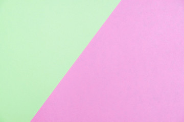 Pastel colored paper flat lay top view, background texture, green and pink