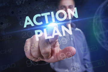 The concept of business, technology, the Internet and the network. A young entrepreneur working on a virtual screen of the future and sees the inscription: action plan