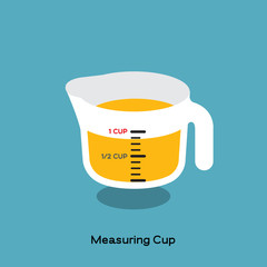 MEASURING CUP
Glass measuring cup, a kitchen utensil, with yellow fluid on blue background. There is scale marked on.