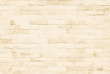 Cream and white brick wall texture background. Brickwork or stonework flooring interior rock old pattern clean concrete grid uneven bricks design stack.