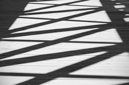 Abstract Shadows of Lines and Figures on a Road as Background or Texture, Black and White Picture © Savvapanf Photo ©