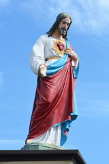 Obraz na płótnie Canvas statue of the christ and the sky