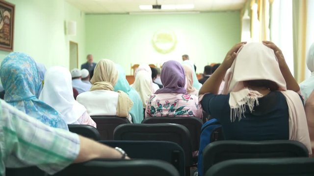 Rear view of muslim women in hijab at the islamic mass rally
