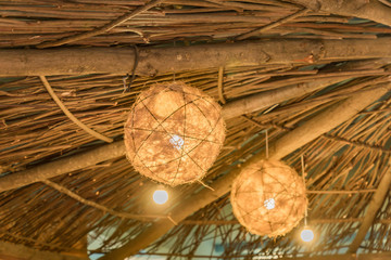 close up of roof of hay rural house with lanterns