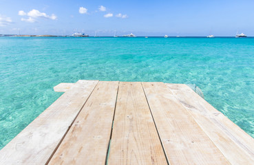 Sea wooden pier and transparent water