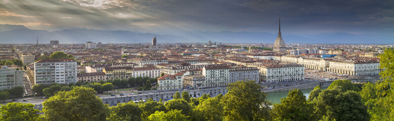 Fototapeta na wymiar day panorama of Turin with summer lights and clouds in Italy