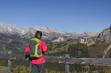 Girl climbing to the top of a beautiful mountain