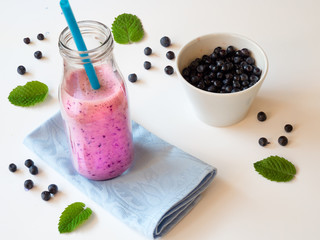 Blueberry smoothie in a glass bottle