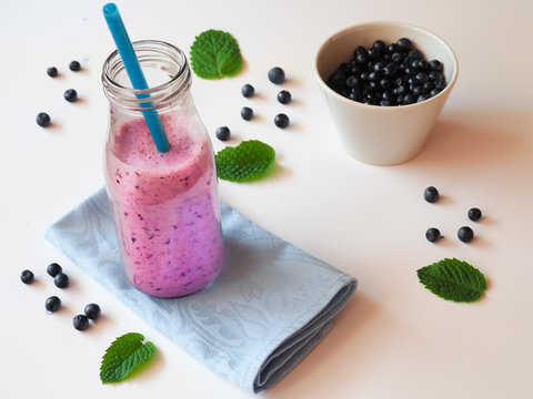Blueberry smoothie in a glass bottle