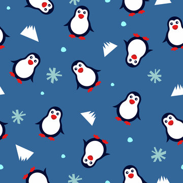 seamless background with penguins and snowflakes on a blue background