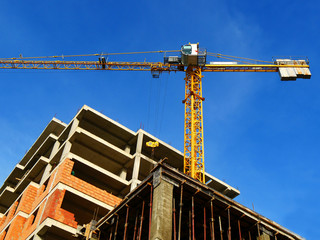 Fototapeta premium Crane near building. Construction site background