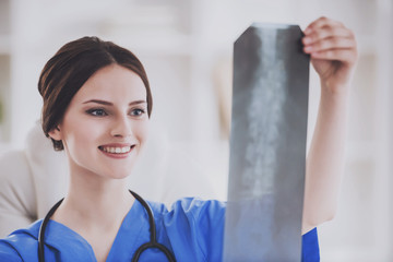 Young Doctor in Blue Uniform Check X-ray Scan.