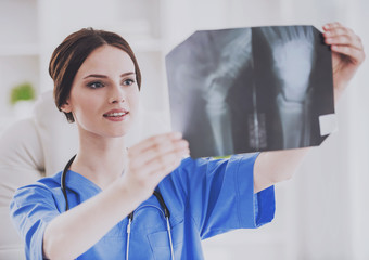 Young Doctor in Blue Uniform Check X-ray Scan.