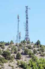 Telecommunication towers with antennas on top of the mountain. Russia, the Republic of Crimea
