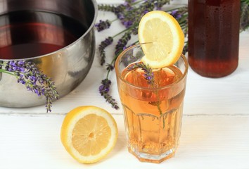 Homemade lavender syrup in  bottle & lemonade / Made from fresh aromatic lavender flowers, sugar or honey and lemon juice