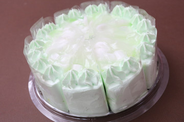 Pandan and coconut cake and white cream topping