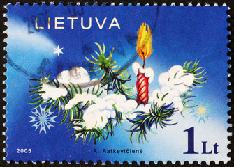 Candle on Christmas tree on stamp of Lithuania
