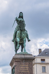 Fototapeta na wymiar Bronze equestrian statue of Jeanne d'Arc (Joan of Arc, 1855) in the centre of Place du Martroi (Martroi square) in Orleans, France.