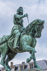 Fototapeta premium Bronze equestrian statue of Jeanne d'Arc (Joan of Arc, 1855) in the centre of Place du Martroi (Martroi square) in Orleans, France.