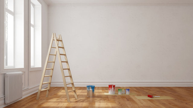 Leiter mit Farbe vor Wand im Raum
