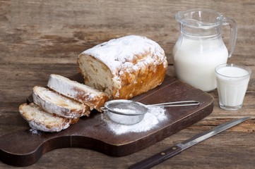 sweet bread with powdered cigars and milk