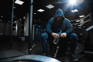 Fototapeta na wymiar Strong man working in gym