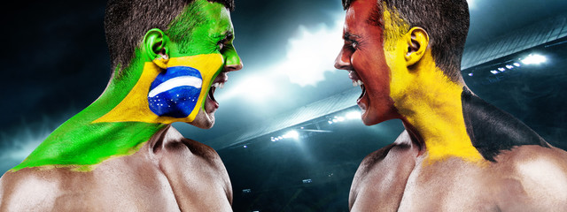 Soccer or football fan with bodyart on face on stadium - flags of Brazil vs Belgium. Sport Concept with copyspace.