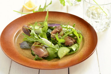 Chicken and vegetable salad with quail eggs