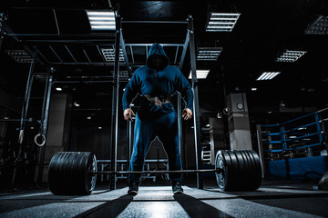 Strong man working in gym