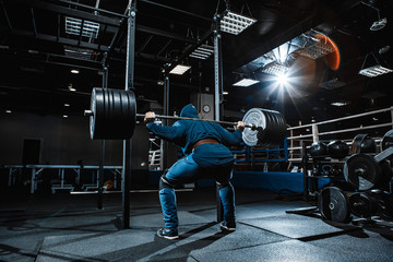 Strong man working in gym