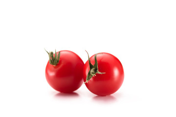 close up view of arranged cherry tomatoes isolated on white