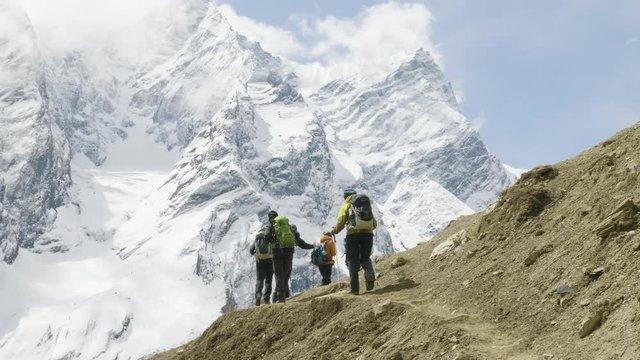 A lot of backpackers on the trekking Larke Pass in Nepal. Manaslu area.