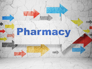 Medicine concept:  arrow with Pharmacy on grunge textured concrete wall background, 3D rendering