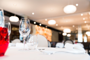 Restaurant Table Red Glass Decoration with Blurred Background.