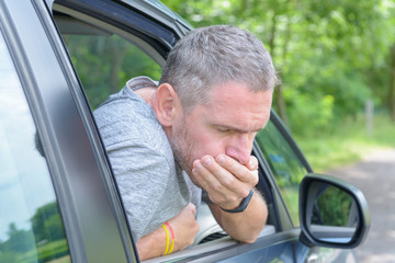 Man suffering from motion sickness