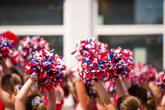 Red, White and Blue Pom Poms, American Cheerleader, Cheerleaders Holding Pom Poms Over Heads, Child Cheerleaders