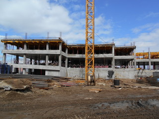 Construction of a multi-apartment residential building. The process of construction. Stages of construction.