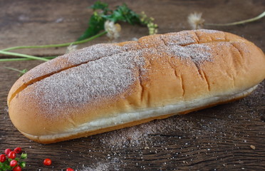 fresh tasty homemade bread on old wooden
