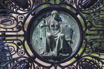 statue on a gate at the international court of justice freedom palace the hague netherlands