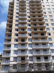 Construction of a multi-apartment residential building. The process of construction. Stages of construction.