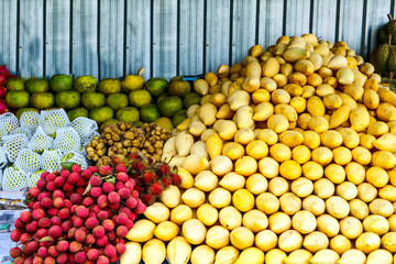 Naklejka na ściany i meble fruits on street market for tourist, mango, orange, Longkong, Longan, Lychee, Dragon fruit