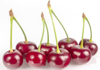 Fototapeta na wymiar Ripe cherries lie on a white background