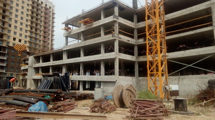 Naklejka premium Construction of a multi-apartment residential building. The process of construction. Stages of construction.