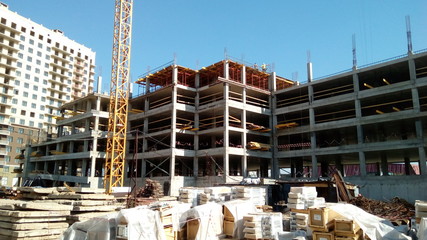 Construction of a multi-apartment residential building. The process of construction. Stages of construction.